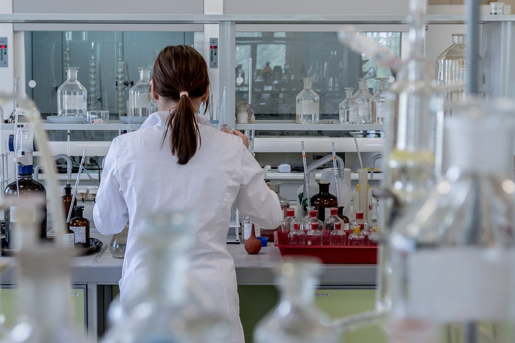 female lab tech testing CBD